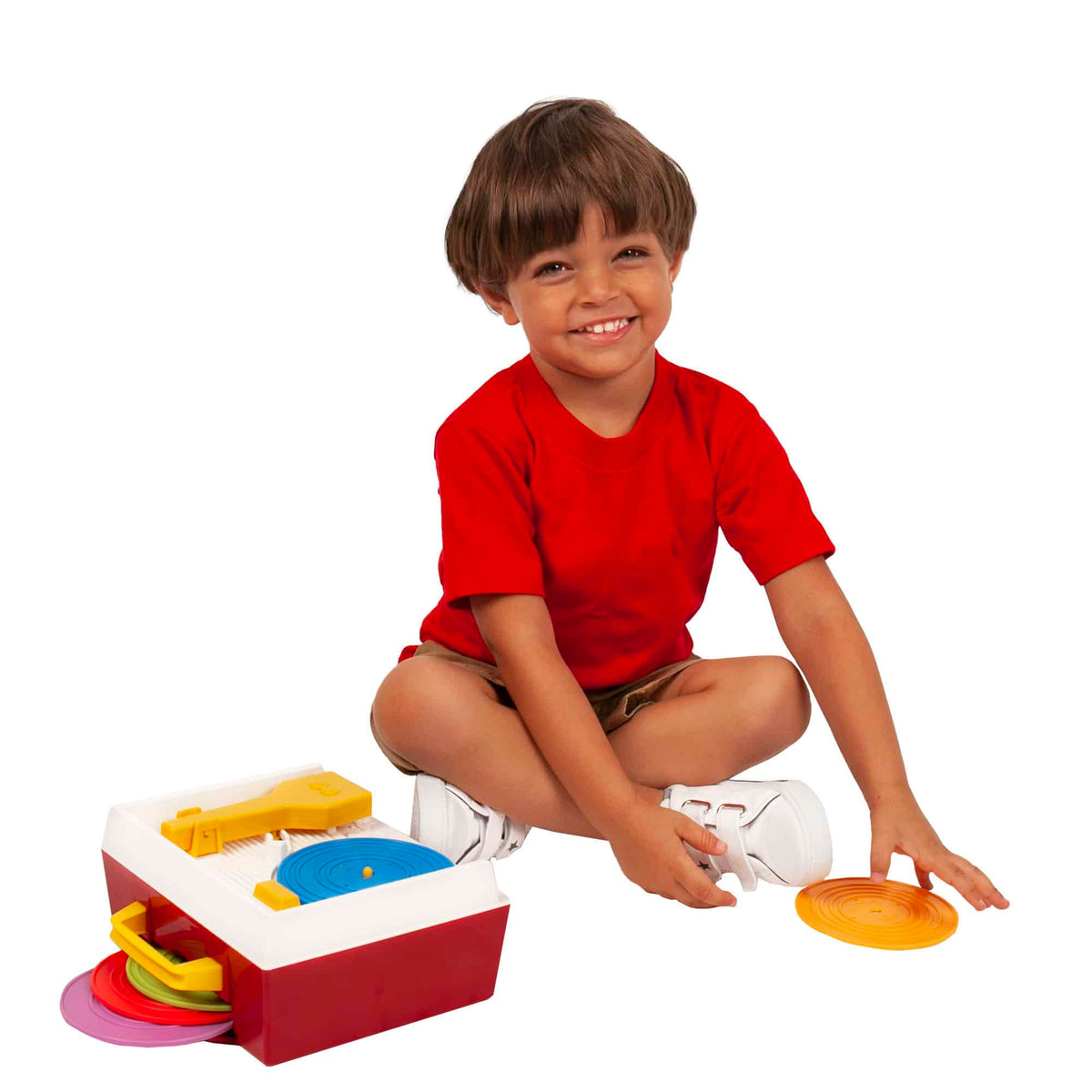 Lifestyle shot of boy playing with the Music Box Record Player
