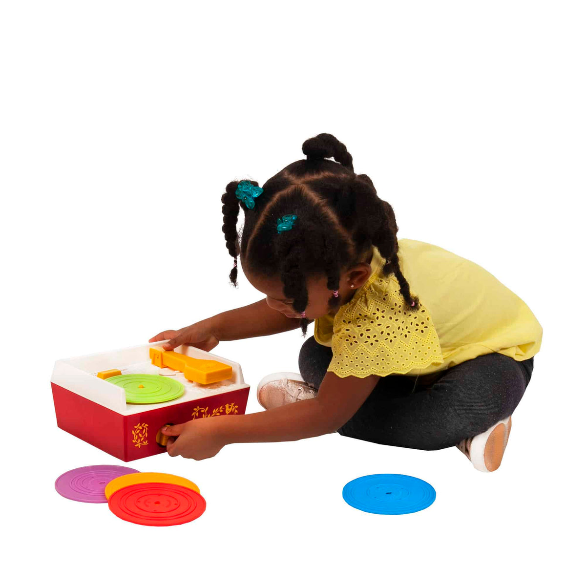 Lifestyle shot of girl playing with the Music Box Record Player