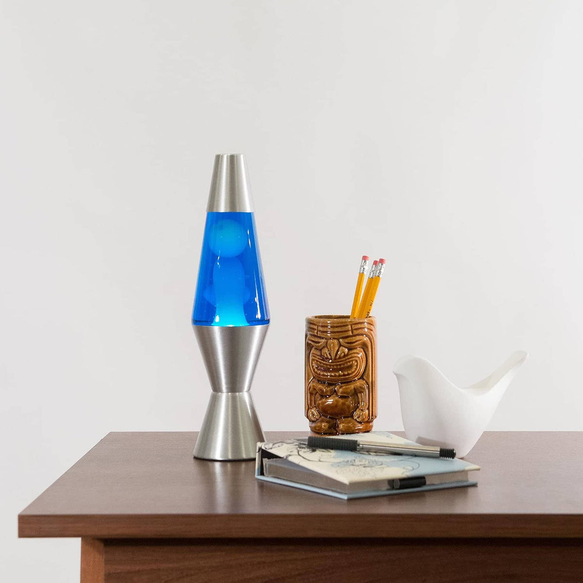 11.5” Lamp – White/Blue/Silver on table with notebook and tiki mug