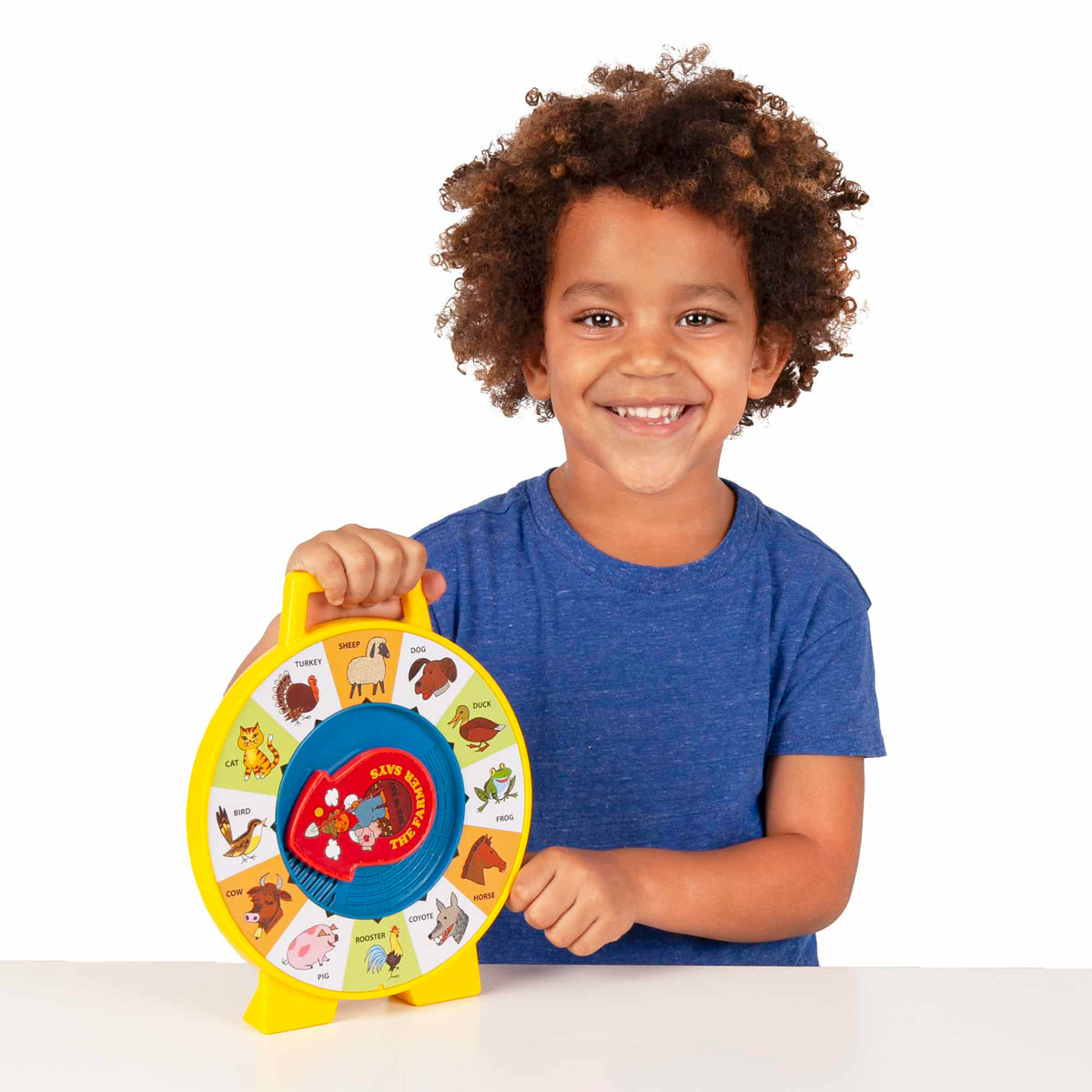 Lifestyle shot of boy holding the See N Say