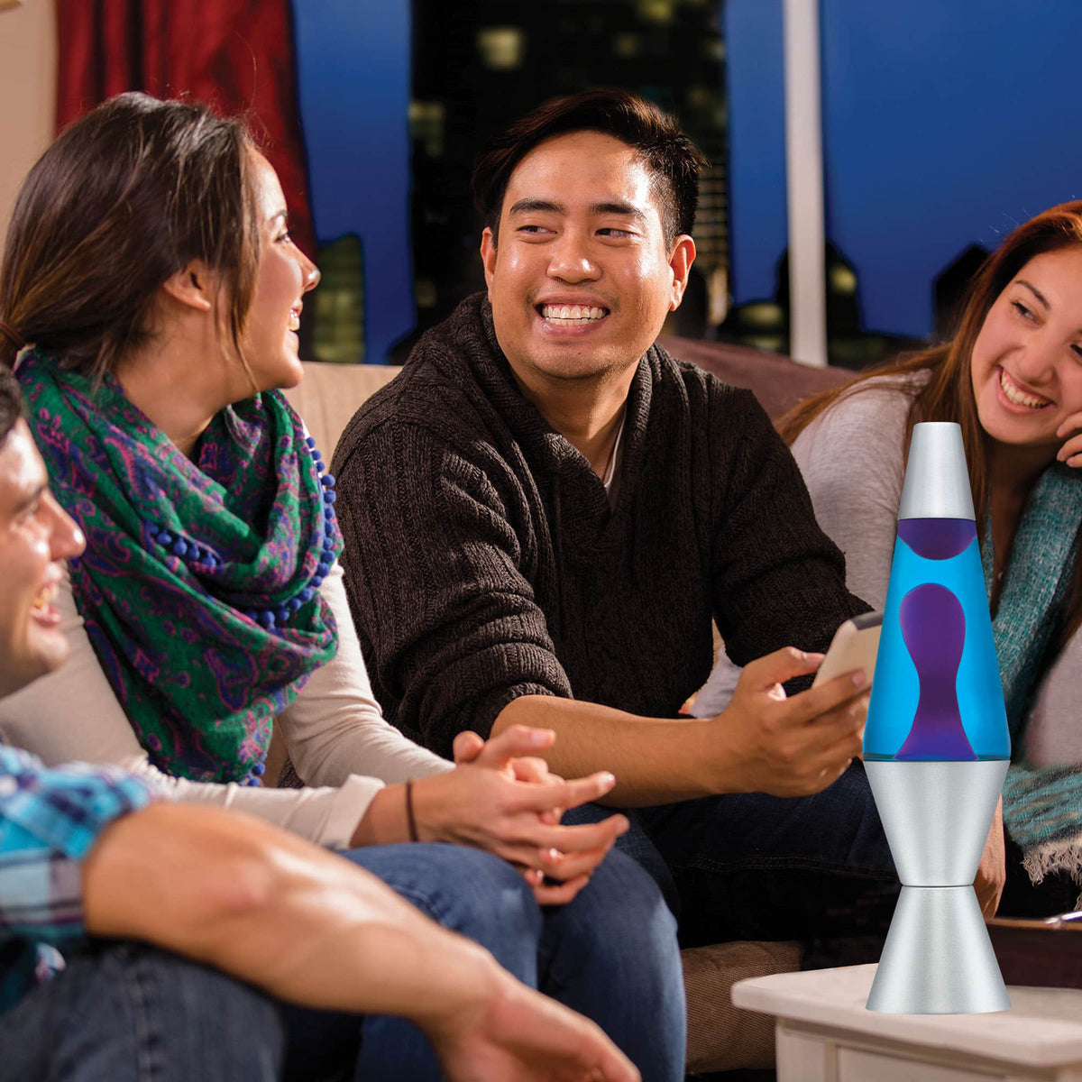 14.5” Lamp – Purple/Blue/Silver on a coffee table at a party