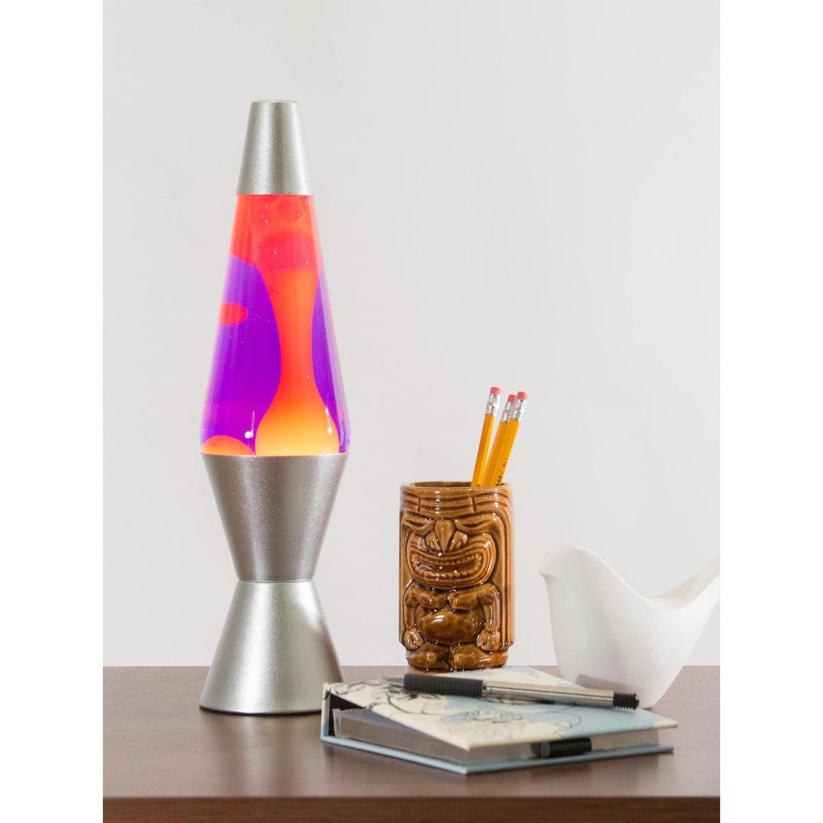 14.5” Lamp – Yellow/Purple/Silver on a table with a notebook and tiki mug pencil cup