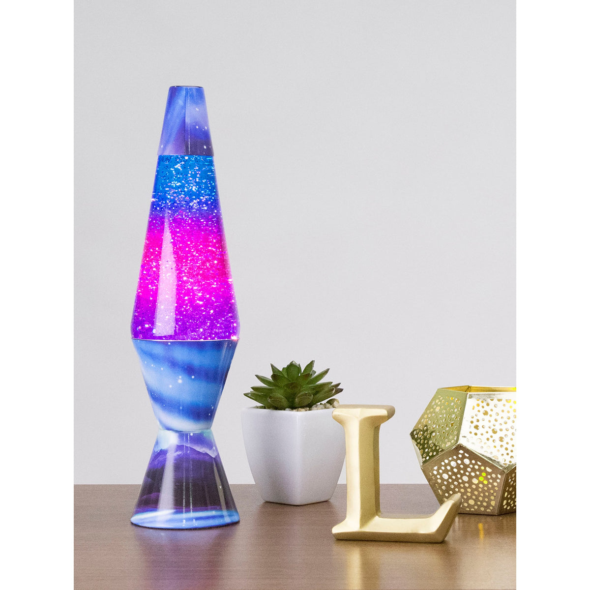 14.5” Lamp Colormax Northern Lights – Glitter on a table with a succulent and a candle