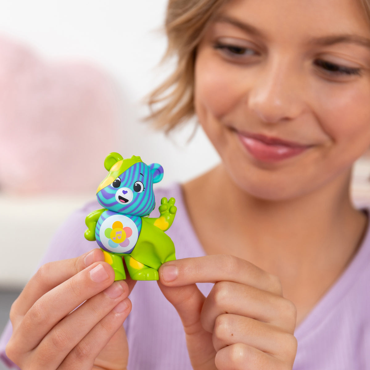Peel and Reveal - Close up Lifestyle shot of smiling girl peeling bear