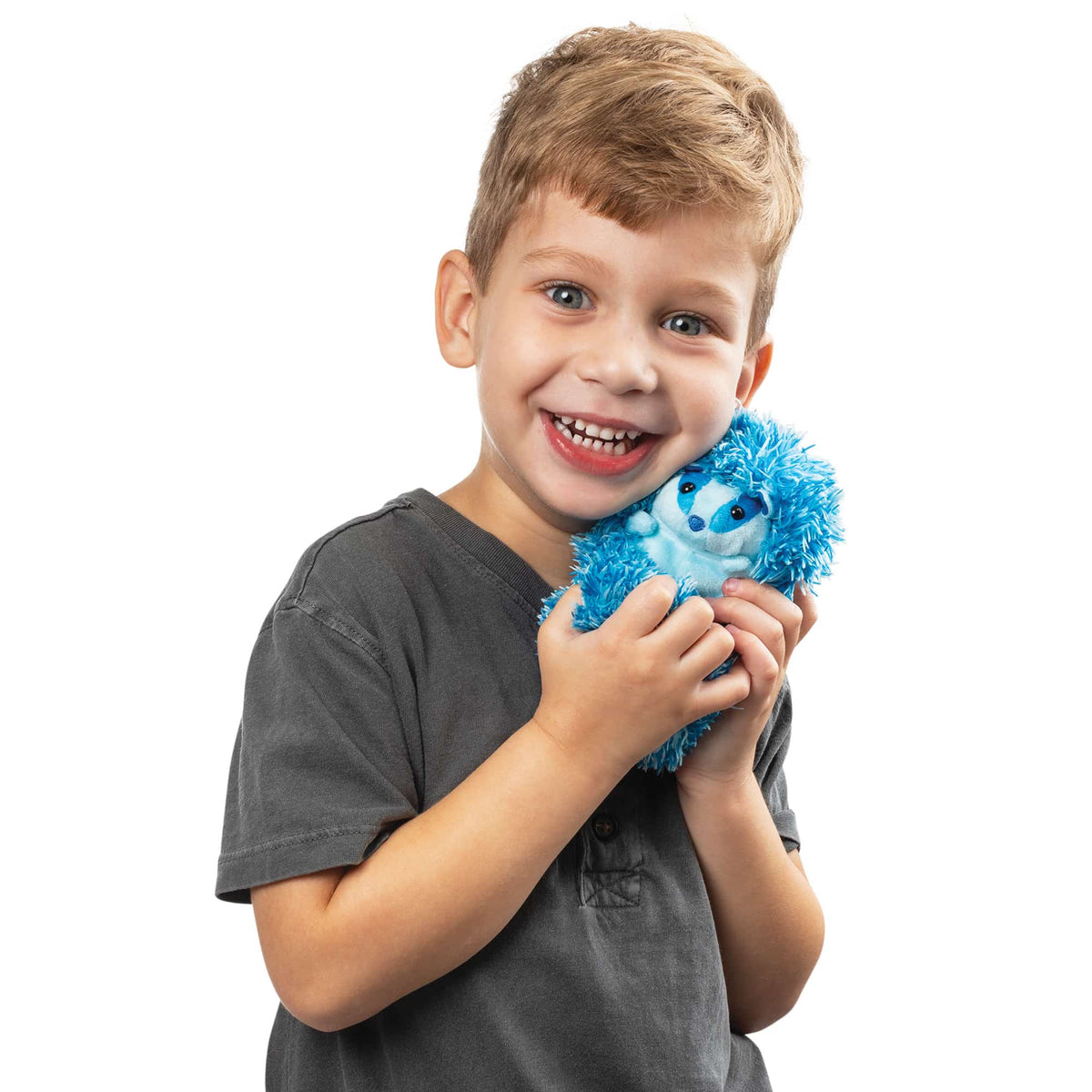 Boy smiling and hugging Blue Badger