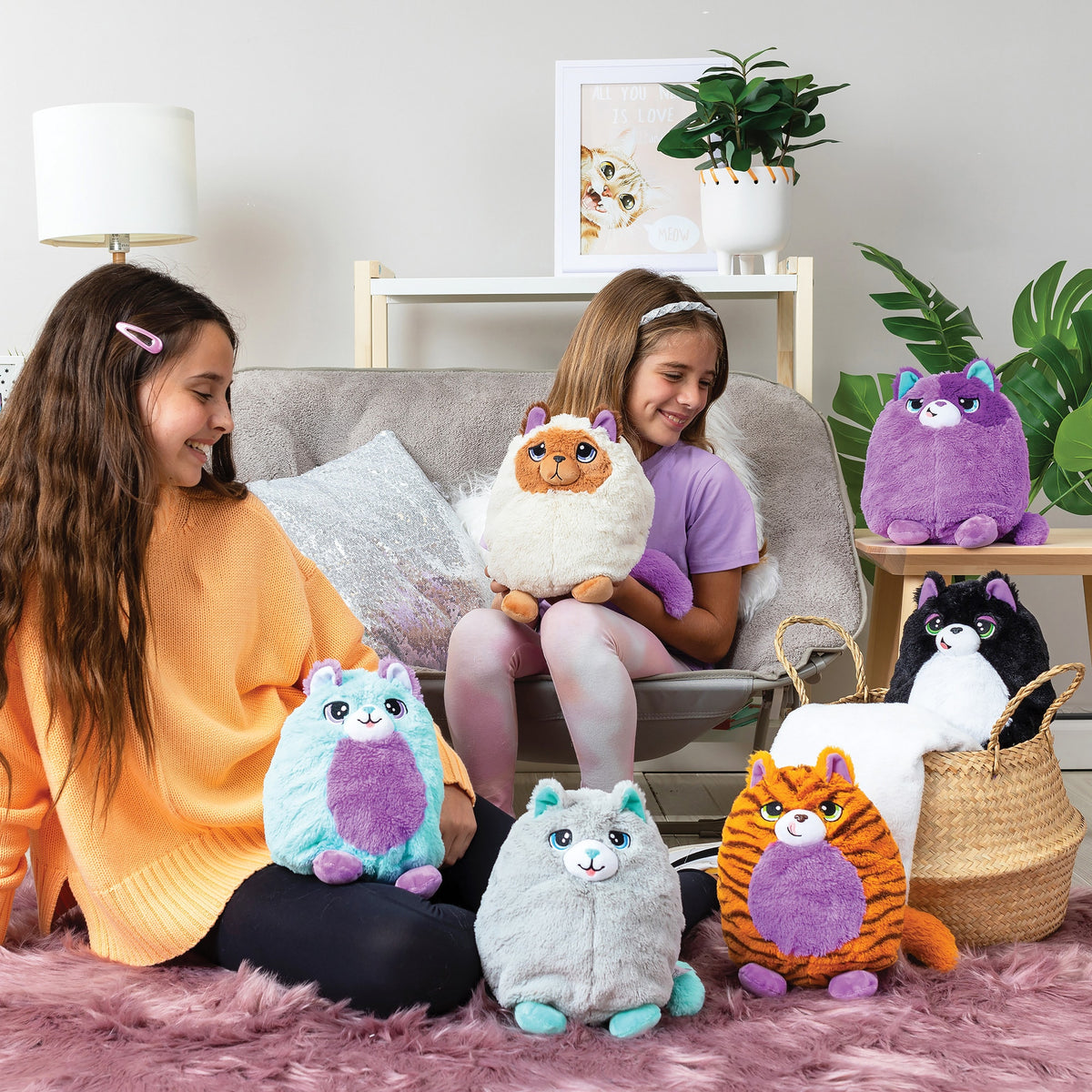Group shot with two girls and 6 assorted plush