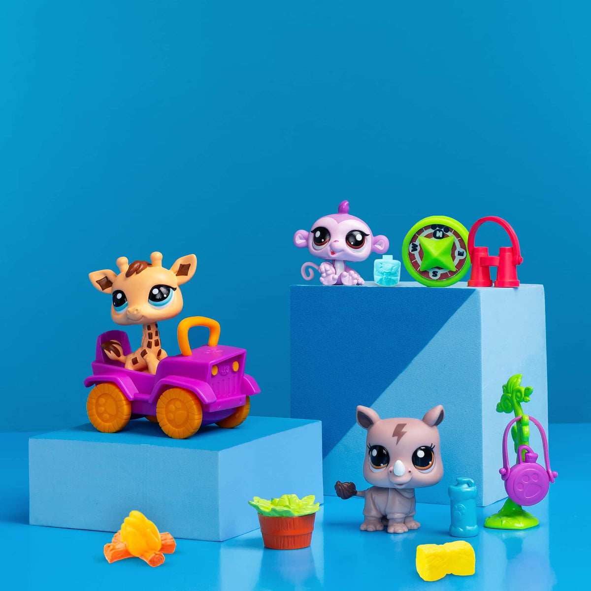 Safari Play Pack - Lifestyle shot of Giraffe, Monkey, and Rhino with accessories