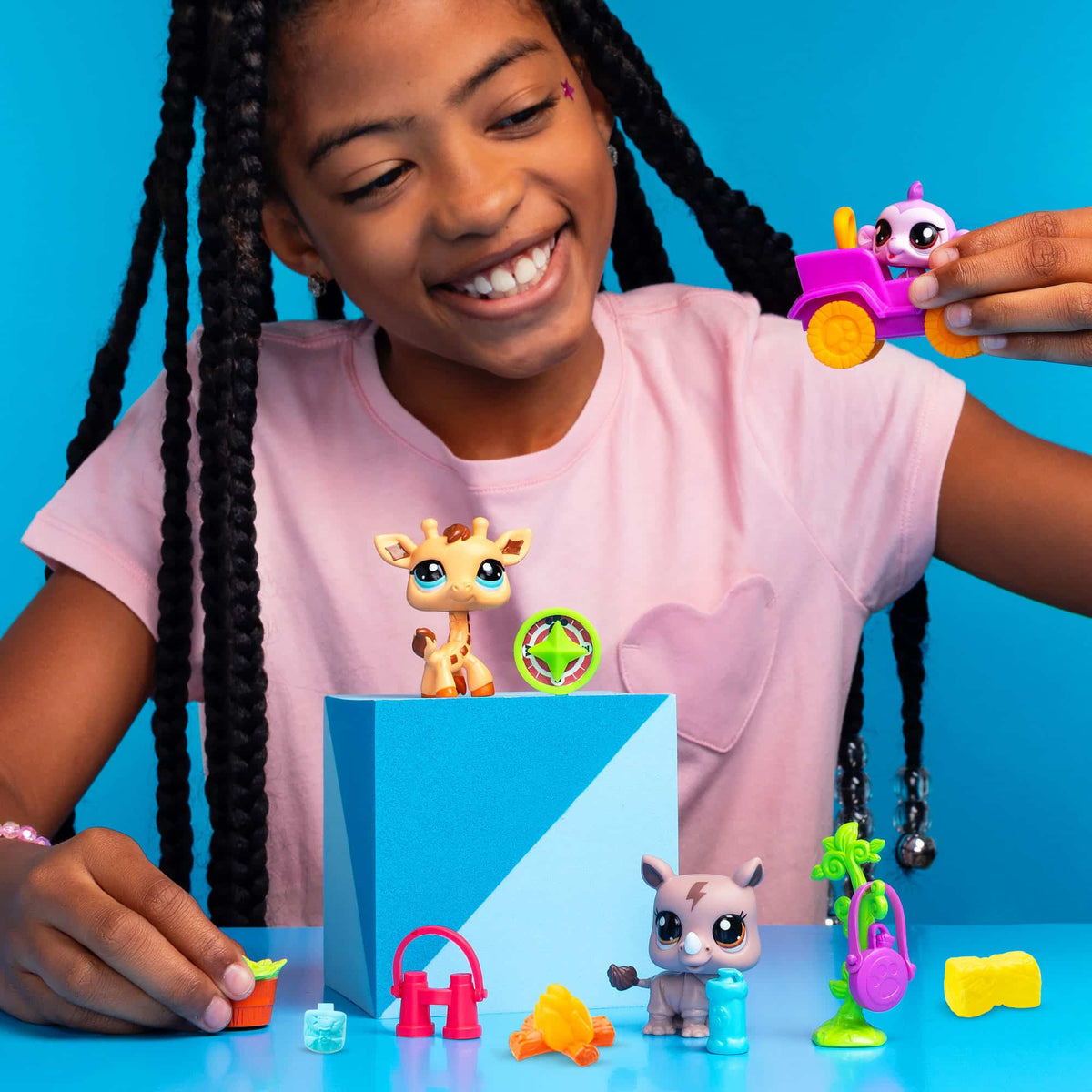 Safari Play Pack - Lifestyle shot of girl playing with the Monkey in a pink car