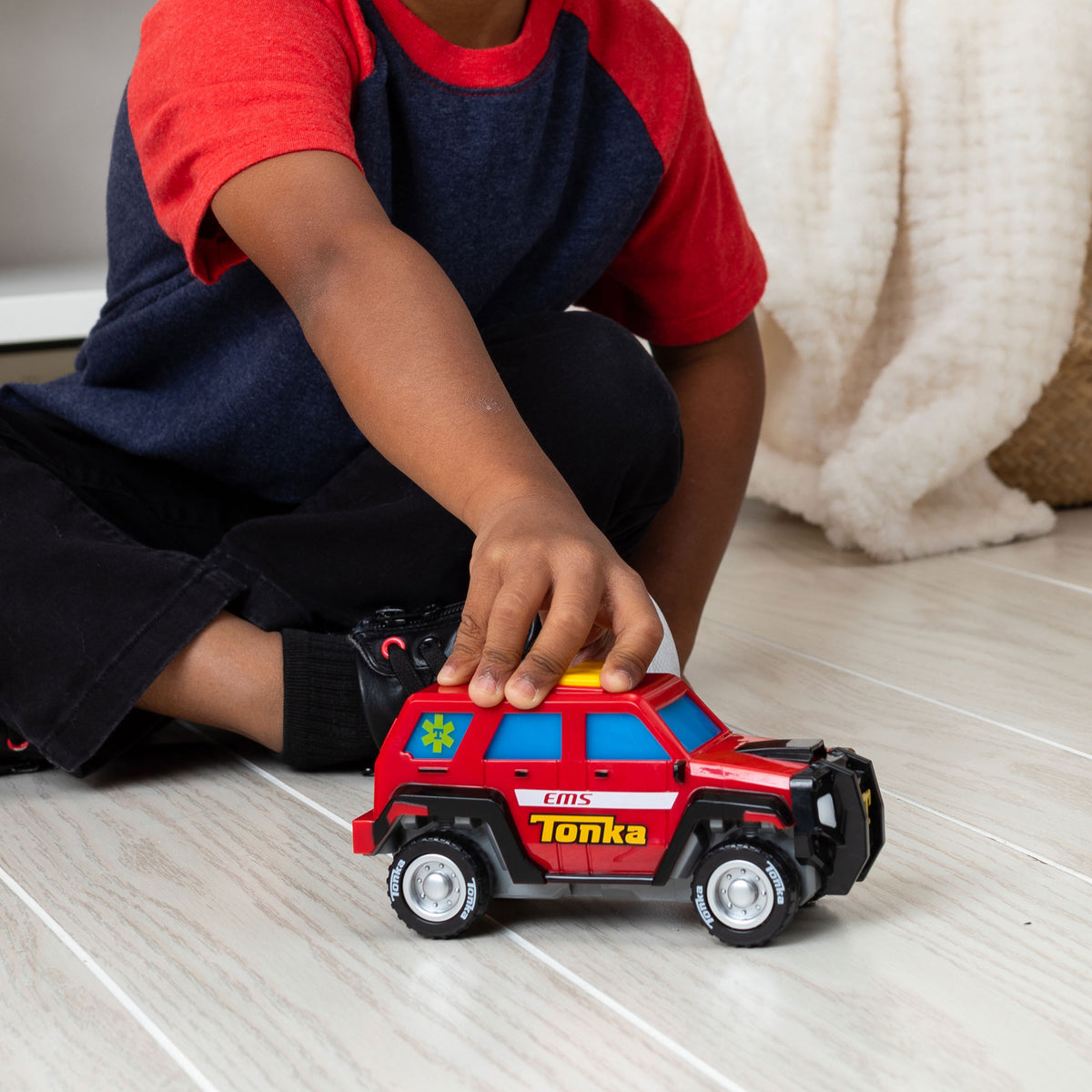Mighty Force - First Responder - Lifestyle shot of boy playing with vehicle on the floor