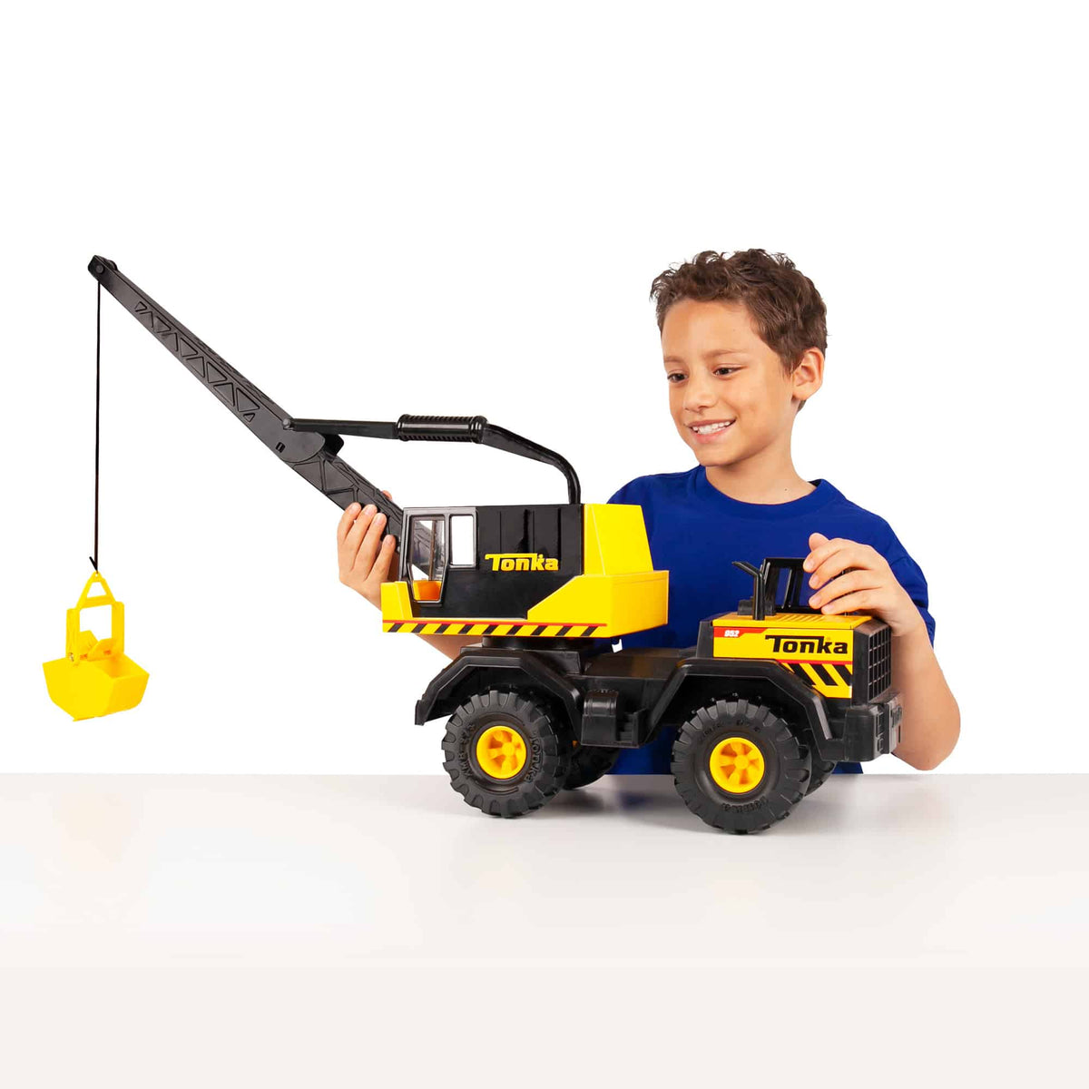 Crane lifestyle shot of boy with the crane on a table