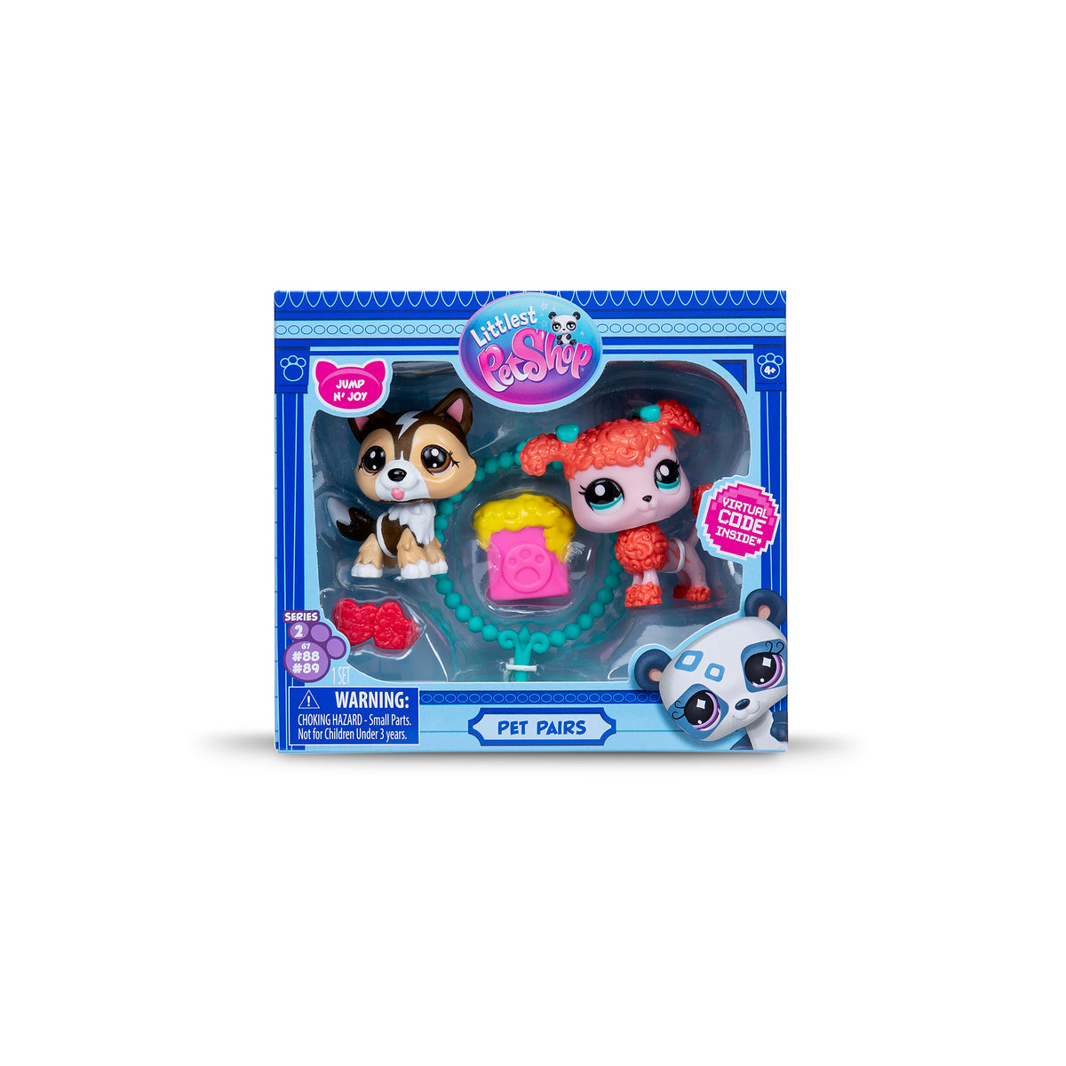 A "Pet Pairs" toy set in a blue box featuring a fluffy brown dog figure and a curly pink poodle dog figure. Accessories include a jumping ring, toy hearts, and popcorn. The packaging includes labels and a warning.