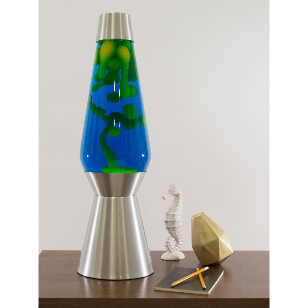 27” Lamp Grande – Yellow/Blue/Silver on a table towering over knick knacks
