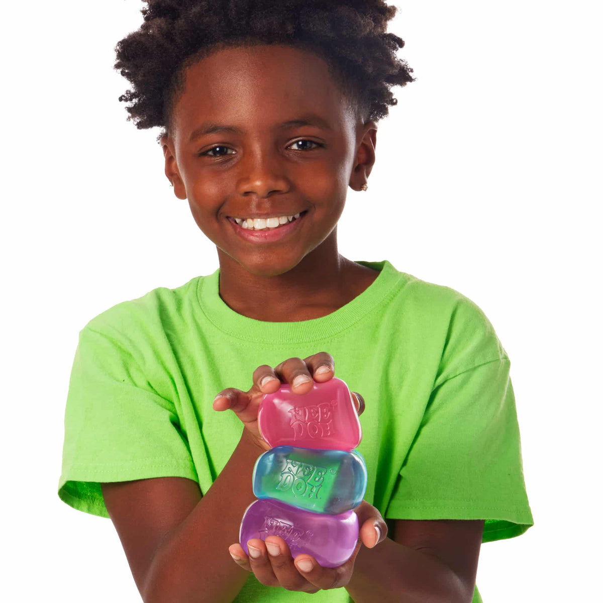 Nice Cube Lifestyle of boy squeezing Nice Cube stack