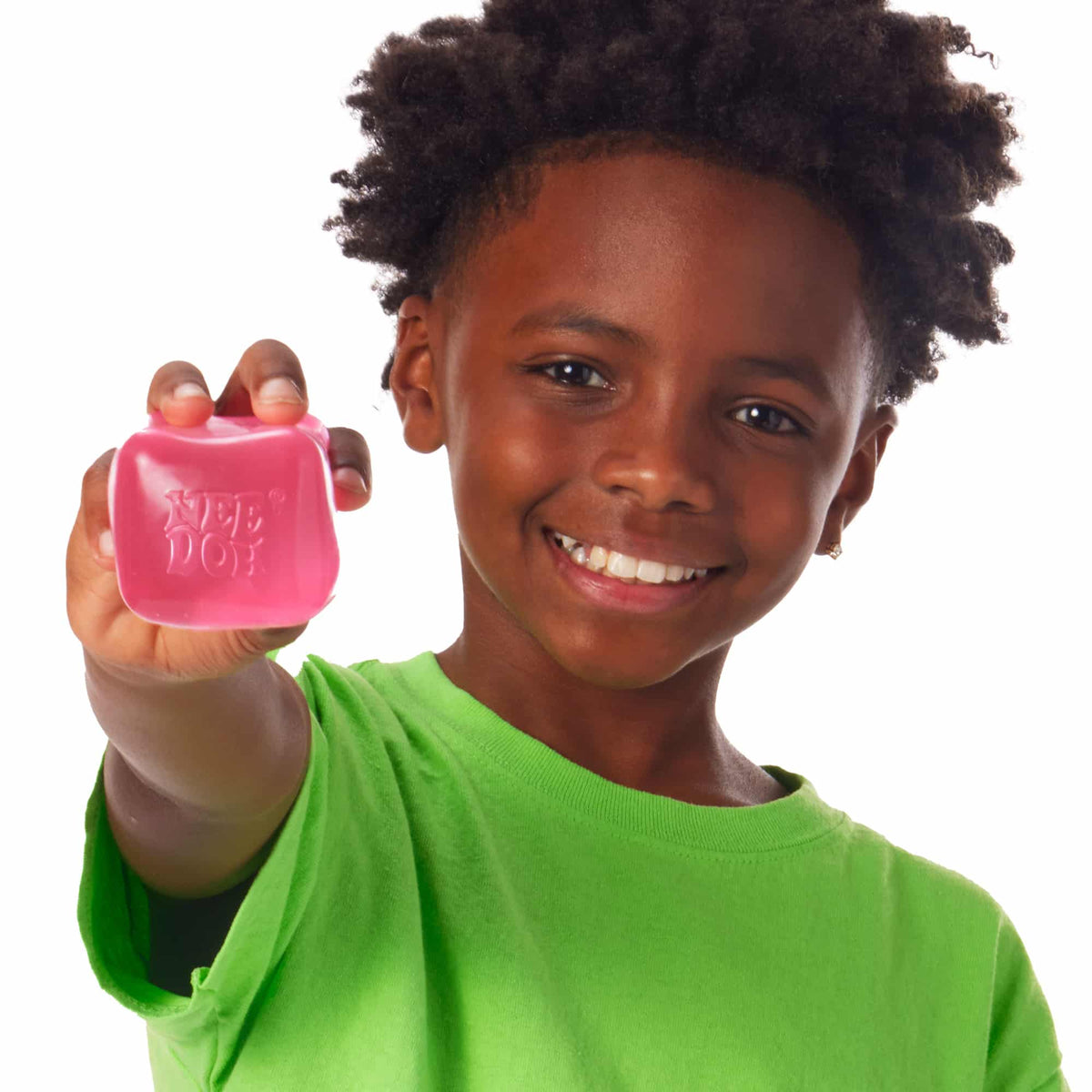 Nice Cube Lifestyle of boy squeezing pink Nice Cube