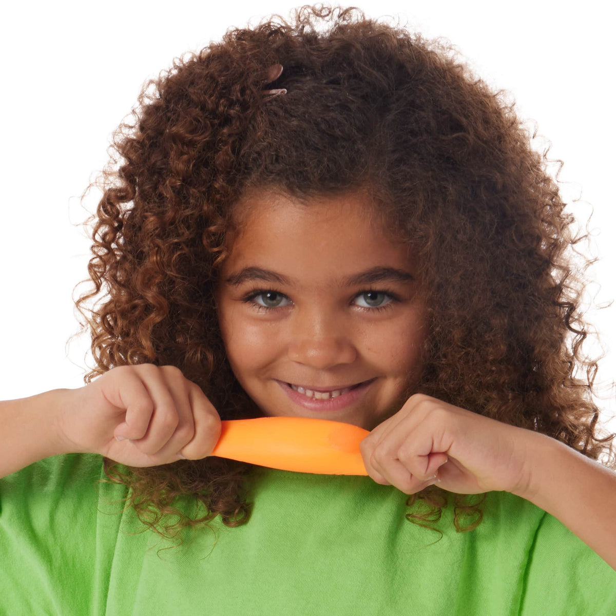 Girl pulling an orange Teenie